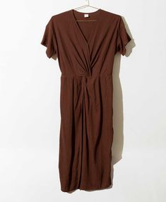 Effortlessly soft fabric in a rich brown hue makes this breezy dress a versatile and comfortable addition to your wardrobe. The chic twisted design elevates this faux wrap dress for a look that can be dressed up or down. Featuring our seasonal Teak color, named for the wood that has long been beloved in India for its versatile properties. Noonday Collection, Twist Dress, Twisted Dress, Breezy Dress, Faux Wrap Dress, Summer Essentials, The Chic, Dress Collection, Soft Fabric