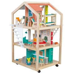 a wooden doll house with furniture and accessories