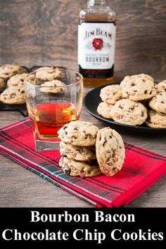 bourbon bacon chocolate chip cookies on a red napkin next to a glass of whiskey and bottle