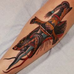 a tattoo on the leg of a person with an animal in it's body