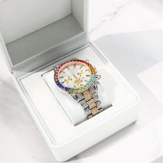 Details: Material Stainless Steel Finish White Gold Plating Material Color White Gold Stone Type Austrian Rhinestone Watch Width 40mm Watch Movement: Japanese Luxury Hallmarked White Gold Jewelry And Watches, Luxury Collectible White Gold Watches, Luxury Iced Out White Gold Jewelry And Watches, Elegant Luxury Multicolor Watches, Iced-out White Gold Watch With Round Dial, White Gold Watch, Gifts Corporate, Rhinestone Watches, Ice Watch