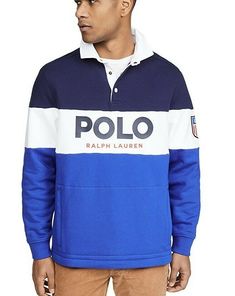 Polo Ralph Lauren LS Logo Rugby Fleece Striped Sweatshirt USA Newport Sz L. Description This blue and white Polo Ralph Lauren logo stripe rugby shirt has been crafted with cotton. Features contrasting panels, this top has a white collar, a short button front opening, a bold logo text print at the front, a logo patch at the sleeve, a kangaroo pocket and long sleeves with ribbed cuffs. Top tip: Team Polo Ralph Lauren is always the winning team Fabric: Mid-weight fleece Collared neck and Blue Long Sleeve Sweatshirt With Logo, Blue Long Sleeve Tops With Logo Detail, Navy Tops With Logo Detail For Fall, Winter Long Sleeve Tops With Logo Detail, Blue French Terry Long Sleeve Tops, Blue Fleece Tops With Embroidered Logo, Casual Fleece Tops With Logo Detail, Navy Winter Tops With Logo Detail, Blue French Terry Tops For Winter