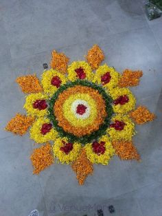 an overhead view of a flower arrangement on the ground