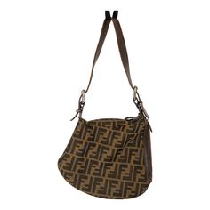 Fendi  FF print shoulder Oyster bag. Zucca FF print shoulder hobo bag. Fendi Oyster vintage shoulder bag in great condition.  Inside and outside are in great condition.  Go for a modern yet intriguing finish with this stylish hobo by Fendi. Closure/Opening: top and side zipper Hardware: matte gunmetal hardware Made in Italy. Highlights: brown leather/canvas FF logo print Adjustable shoulder strap Top zip fastening Internal logo patch. Dimensions: Total Length with shoulder strap 18 in.  Bag: 8 i Fendi Aesthetic, Gunmetal Hardware, Ff Logo, Vintage Shoulder Bag, Fendi Baguette, Strap Top, Italian Luxury, Strap Tops, Fashion House