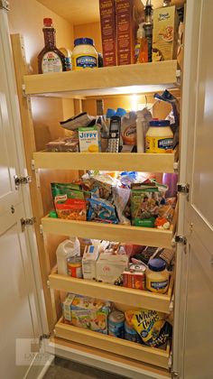 an open refrigerator with lots of food in it's door and shelves on both sides