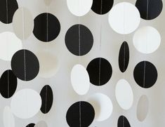 black and white paper circles hanging from the ceiling