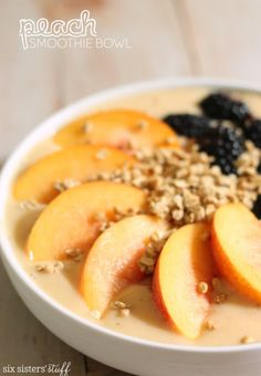 a white bowl filled with oatmeal and fruit