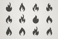 a set of nine black fire flames on a white background, each with different shapes and sizes