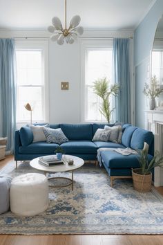 a living room with blue couches and rugs