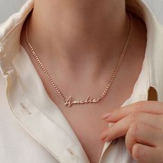 The necklace features a custom-crafted name with up to nine characters in cursive type and a classic curb chain that is perfect for beefing up your layers. Metal: 925 sterling silver; optional 18k yellow / white / rose gold vermeil Thickness: 1 mm / 0.04" Chain style: 3 mm / 0.12" silver curb chain Hypoallergenic: nickel-free materials used therefore suitable for those with metal allergies Different Lettering Styles, Necklace With Name, Handwriting Necklace, Sterling Silver Name Necklace, Cursive Script, Curb Chain Necklace, Solid Gold Necklace, Nameplate Necklace, Lettering Styles