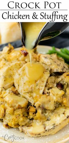 the crock pot chicken and stuffing is being drizzled with gravy