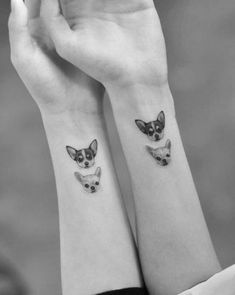 two small chihuahua tattoos on both wrist and arm, one with a dog's head