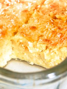 a close up of a piece of food in a glass bowl on a table top