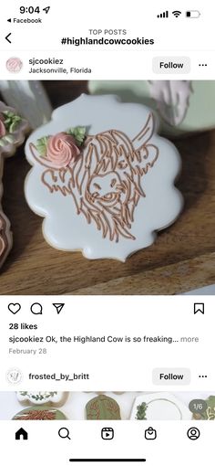 the cookies are decorated with icing and flowers on top of each other, along with an image of a cow's head