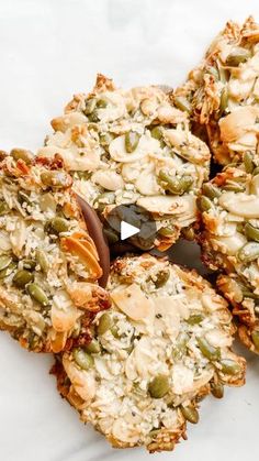 an assortment of cookies on a plate with a spoon