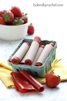 some strawberries and other fruit on a table