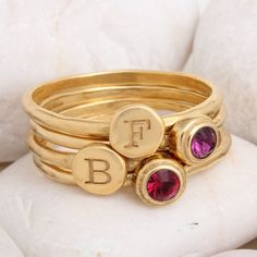 "This set of stackable rings is perfect for the mother or grandmother of two. Pair an initial and birthstone for each child. Also makes a great couple's ring, pair you and your special someone's initial and birthstone as a reminder throughout the day of the love you share. You will adore these sweet rings that add just the right amount of bling to your day. **This listing is for a set of 4 rings - 2 initial rings and 2 birthstone rings. Each ring is 24K gold vermeil and has either one letter/sym Gold Ring Stacking, Initial Rings, Gold Bracelet Simple, Birthstone Stacking Rings, Stack Rings, Sweet Ring, Birthstone Rings, Stacking Ring Set, Initial Ring