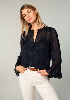 elevated bohemian blouse adds a luxurious touch to any outfit. Designed in an embroidered chiffon, with a self-covered button front, a ruffled neckline, and long flowy flutter sleeves. Elegant Blouse With 3/4 Blouson Sleeves, Elegant Long Sleeve Embroidered Top For Fall, Chic Floral Embroidered Blouse For Fall, Chic Floral Embroidery Blouse For Fall, Elegant Flutter Sleeve Blouse For Brunch, Elegant Ruffled 3/4 Sleeve Blouse, Elegant Ruffled Blouse With 3/4 Sleeves, Elegant Blouse With Flutter Sleeves For Brunch, Elegant Blouse With Ruffles And 3/4 Sleeves