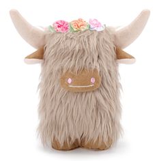 a stuffed animal with flowers on its head