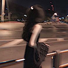 a blurry image of a person standing in the street