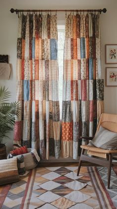 a chair sitting in front of a window covered in colorful patchwork curtains and rugs