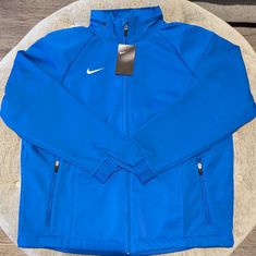 Brand New With Tags. Nike Blue Hooded Windbreaker, Blue Hooded Nike Windbreaker, Blue Nike Windbreaker For Outdoor, Blue Nike Track Jacket For Outdoor Activities, Nike Blue Windbreaker For Outdoor, Nike Blue Track Jacket For Outdoor Activities, Blue Functional Track Jacket For Winter, Blue Functional Winter Track Jacket, Sporty Blue Outerwear With Double-lined Hood