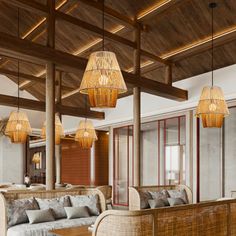 a living room filled with lots of furniture under wooden ceiling lights and hanging lamps above the couches