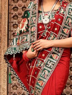 <ul>
<li style="text-align: justify;"><span data-preserver-spaces="true">Spark a unique dignity to your essence by drapping panetar saree in red hue made with silk material accomplished with colored peacock, elephant, kalash, swastik motifs on it border and also has heavy embellished pallu with doli/ baraat scene and saubhagyawati bhava written on lace elevate pallu border with thread tessels.  </span></li>
<li style="text-align: justify;"><span d Red Blouse With Dupatta For Festivals, Festival Celebration Blouse With Dupatta, Red Wedding Blouse With Pallu, Red Embroidered Blouse For Wedding, Red Blouse With Motifs And Traditional Drape, Red Blouse With Resham Embroidery For Celebration, Red Embroidered Dupatta For Celebration, Ceremonial Red Choli For Transitional Season, Ceremonial Festive Blouse With Motifs