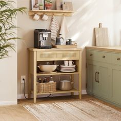 a kitchen with green cabinets and white walls, including a coffee maker on top of a wooden shelf