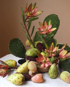 a table topped with lots of different types of flowers