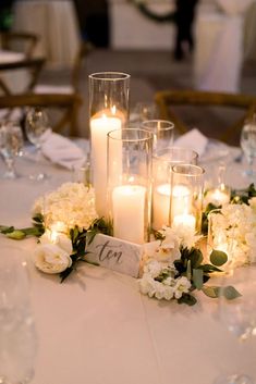 a table with candles and flowers on it