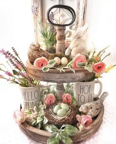 two tiered trays with flowers and eggs