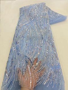 This high quality Fabric is measured in 5 Yards With Embroidered Beading and Sequin. It is soft, very delicate and beautiful. This high Quality Fabric is made with Fashion embroidered rhinestones can be used in making party wedding dresses, skirts, shawls, scarves and other other fashion apparels as you would like. Size : Length : 5 yards (180 inch). Width: 50 inch (Please allow slight deviation for the measurement data ,±1 inch) Material: 100% Polyester, Tulle Lace Fabric, Eco-Friendly embroide Elegant Embroidered Fabric With Rhinestones For Party, Party Embellished Organza Embroidered Fabric, Party Embellished Embroidered Organza Fabric, Beaded Organza Embroidered Fabric For Party, Evening Embroidered Lace Fabric With Rhinestones, Fitted Embroidered Fabric With Rhinestones For Evening, Evening Lace Fabric With Rhinestones, Party Lace Fabric With Rhinestones Embroidery, Blue Embroidered Wedding Fabric With Rhinestones