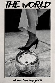 a woman's feet on top of a disco ball with the words, it's under my feet