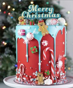 a christmas cake decorated with gingerbreads and candy