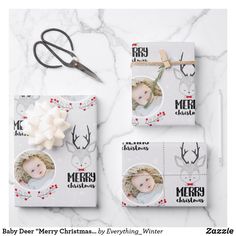 three christmas cards with reindeer heads on them and a pair of scissors next to it