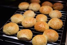 rolls are cooling on a rack in the oven