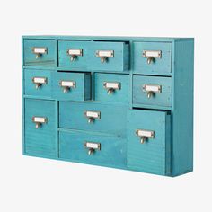 an old blue cabinet with many drawers