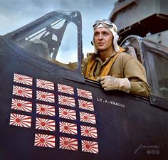 a man sitting in the cockpit of an airplane