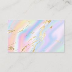 a business card with an abstract design on the front and bottom, in pastel colors