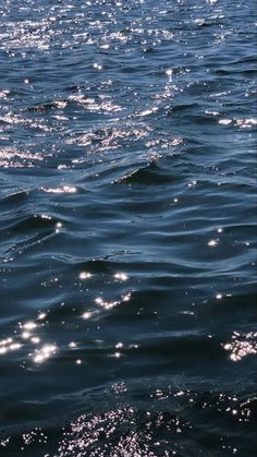 the sun shines brightly on the water as it reflects off the ocean's surface