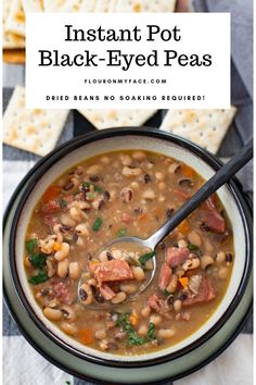 instant pot black - eyed pea soup in a bowl with crackers on the side