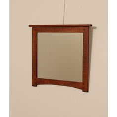 a mirror mounted to the side of a wall