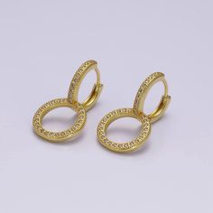 If you receive a defective item, please contact us within 5 days of arrival. Item Details - - Sold as a pair - Material: Brass, 14K gold filled, cubic zirconia - Nickel free & lightweight, perfect for everyday wear - Lever back fastening - Size: 25.1 mm x 13.9 mm x 1.8 mm Please avoid any water or chemical solutions. Keep the item in a dry environment. Gold Huggie Earrings With Halo In Fine Jewelry Style, Gold Huggie Earrings With Halo Detail, Gold Halo Huggie Earrings Fine Jewelry, Gold Huggie Earrings With Halo Design As Gift, Fine Jewelry Gold Hoop Earrings With Halo Design, Gold Huggie Diamond Earrings With Halo, Gold Hoop Diamond Earrings With Halo Design, Gold Diamond Hoop Earrings With Halo, Gold Hoop Diamond Earrings With Vvs Clarity