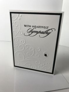 a greeting card with the words sympathy written in cursive writing on white paper