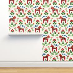 the wall paper is decorated with red and green deers, flowers and leaves on it