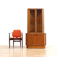 "**Please Note: SHIPPING IS NOT FREE. Please read entire description.** This fabulous mid century corner cabinet was manufactured by Turnidge of London during the 1960s. Produced in teak, this minimalist cabinet has a sleek shape, with two upper shelves and bottle/glass storage below, it has quality construction throughout. DIMENSIONS: 33.5\" wide x 20\" deep x 67\" high CONDITION: This fantastic side table is in excellent vintage condition. Please study the pictures carefully for a more accurat Corner Buffet Cabinet, Primitive Corner Cabinet, Corner Buffet, Mid Century China Cabinet, Corner Curio Cabinet, Corner Bar Cabinet, Corner Hutch, Minimalist Cabinet, Corner Bar