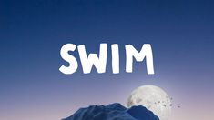 the words swim are in front of a full moon and mountain with snow on it