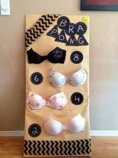 a bulletin board with bras on it in front of a wall and a door