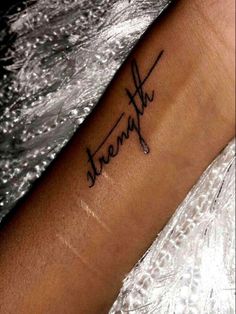 a person with a tattoo on their arm that says,'dearly'in cursive writing